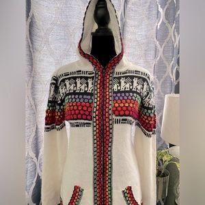 Sweater, small, and tight to the body.